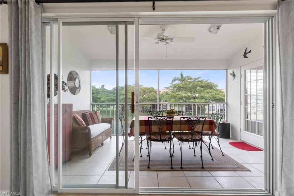 359 Dover Place, Unit E204 Naples, FL 34104 - Photo 32 of 49 a view of a dining room with furniture window and outside view