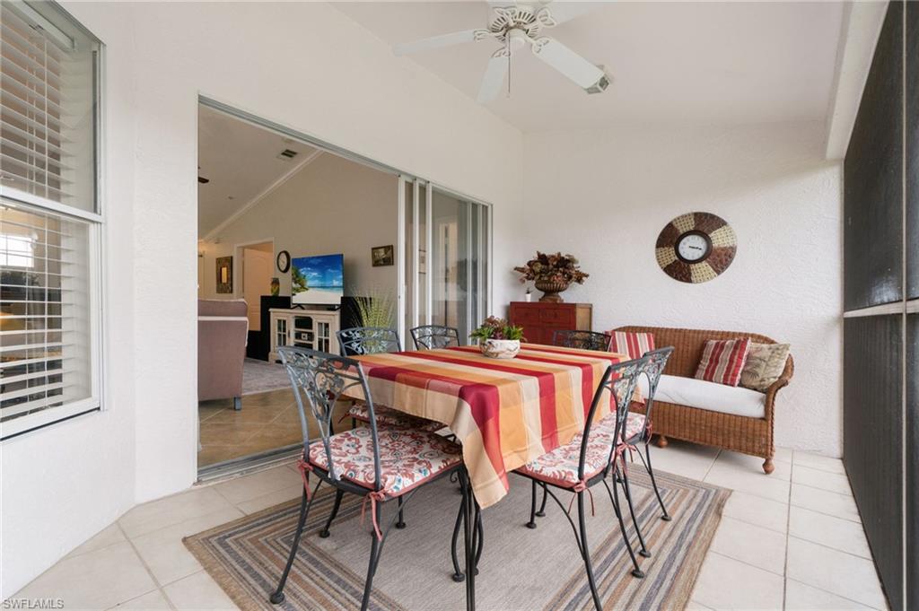 359 Dover Place, Unit E204 Naples, FL 34104 - Photo 33 of 49 a dining room with furniture and wooden floor