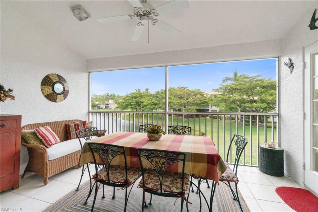 359 Dover Place, Unit E204 Naples, FL 34104 - Photo 34 of 49 a view of a dining room with furniture window and wooden floor