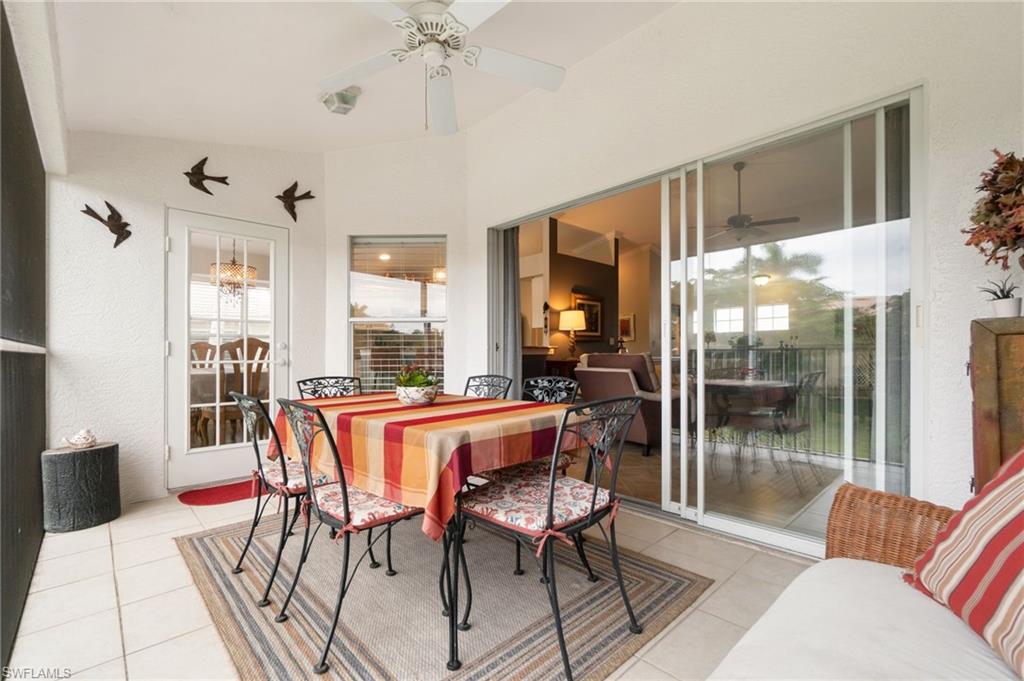359 Dover Place, Unit E204 Naples, FL 34104 - Photo 35 of 49 a view of a dining room with furniture window and wooden floor