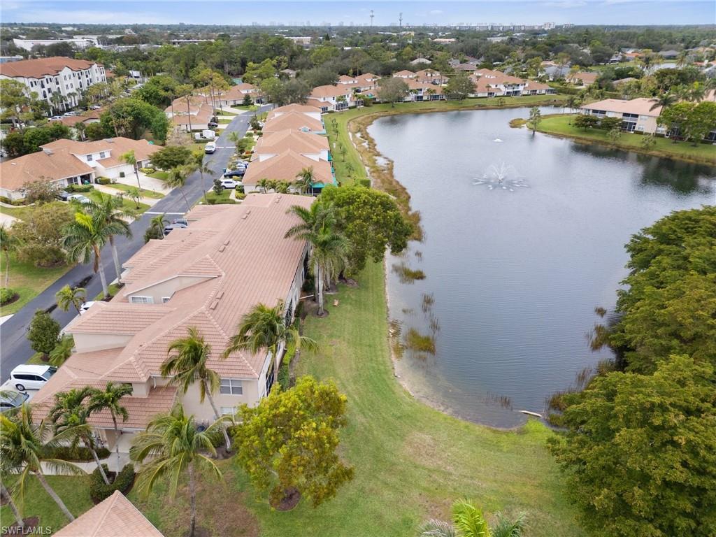 359 Dover Place, Unit E204 Naples, FL 34104 - Photo 40 of 49 an aerial view of residential houses with outdoor space