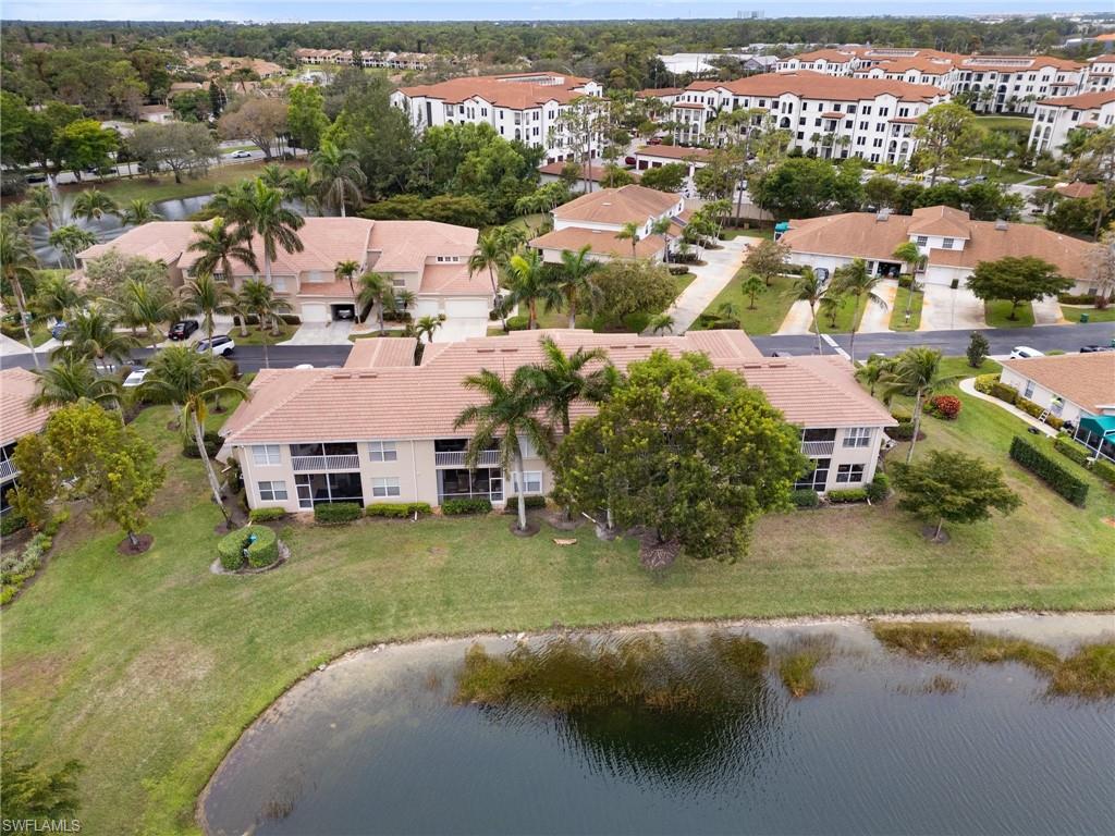 359 Dover Place, Unit E204 Naples, FL 34104 - Photo 41 of 49 an aerial view of residential houses with outdoor space and swimming pool