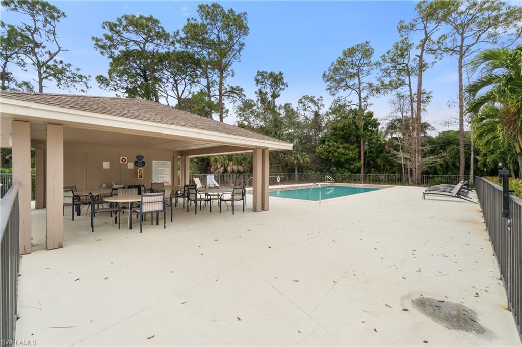 359 Dover Place, Unit E204 Naples, FL 34104 - Photo 44 of 49 an outdoor view with patio