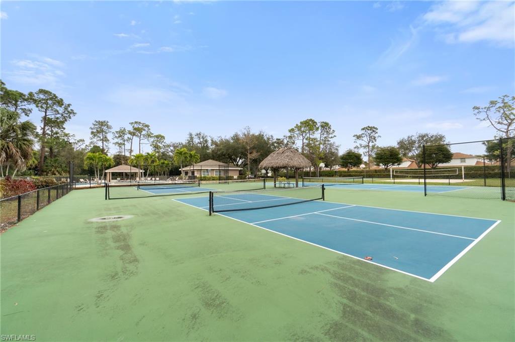 359 Dover Place, Unit E204 Naples, FL 34104 - Photo 45 of 49 a view of a tennis court