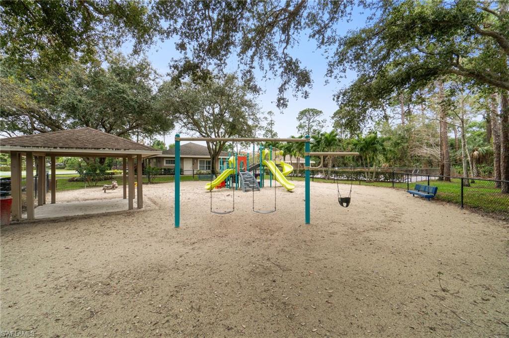 359 Dover Place, Unit E204 Naples, FL 34104 - Photo 46 of 49 a view of a park with swings