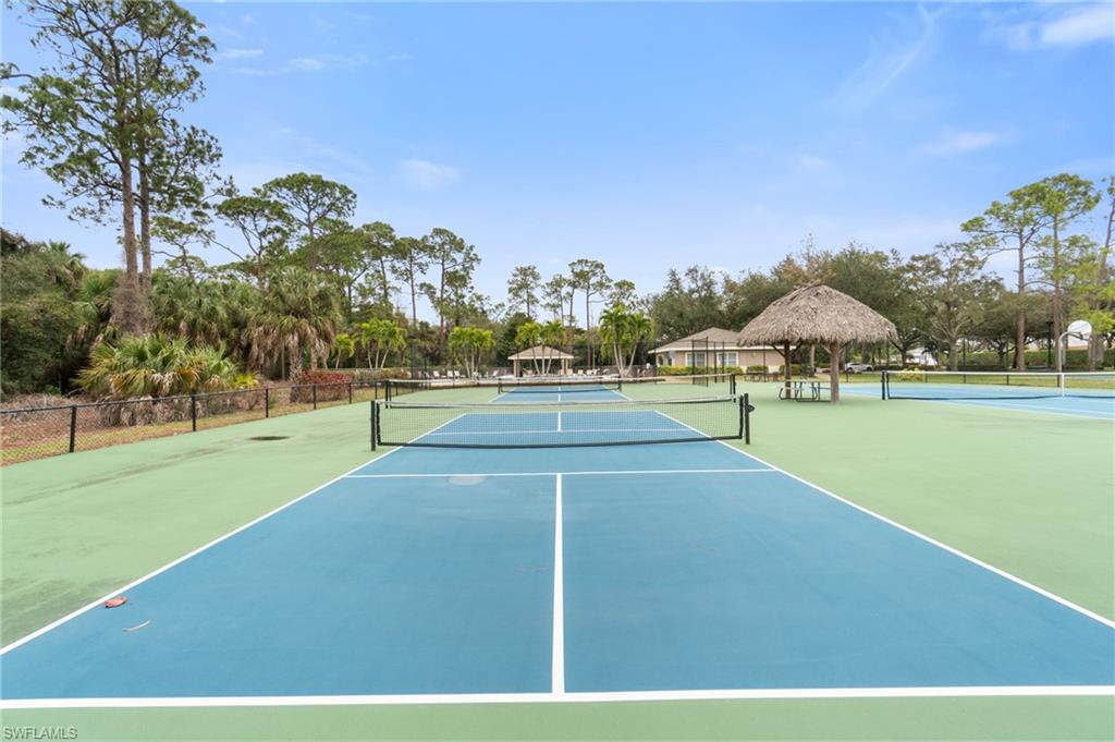 359 Dover Place, Unit E204 Naples, FL 34104 - Photo 47 of 49 a view of a tennis court