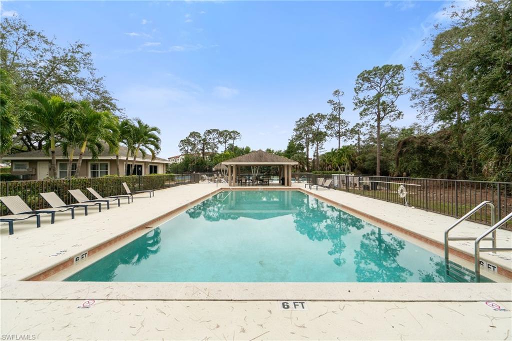 359 Dover Place, Unit E204 Naples, FL 34104 - Photo 48 of 49 a view of a swimming pool with a lake view