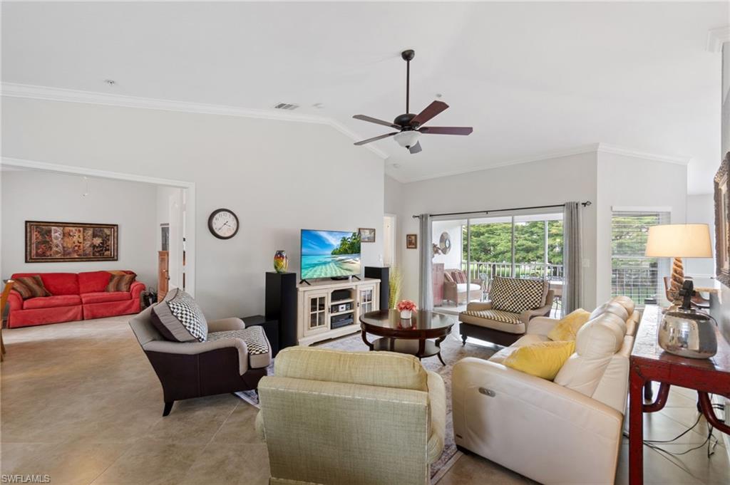 359 Dover Place, Unit E204 Naples, FL 34104 - Photo 9 of 49 a living room with furniture and a large window