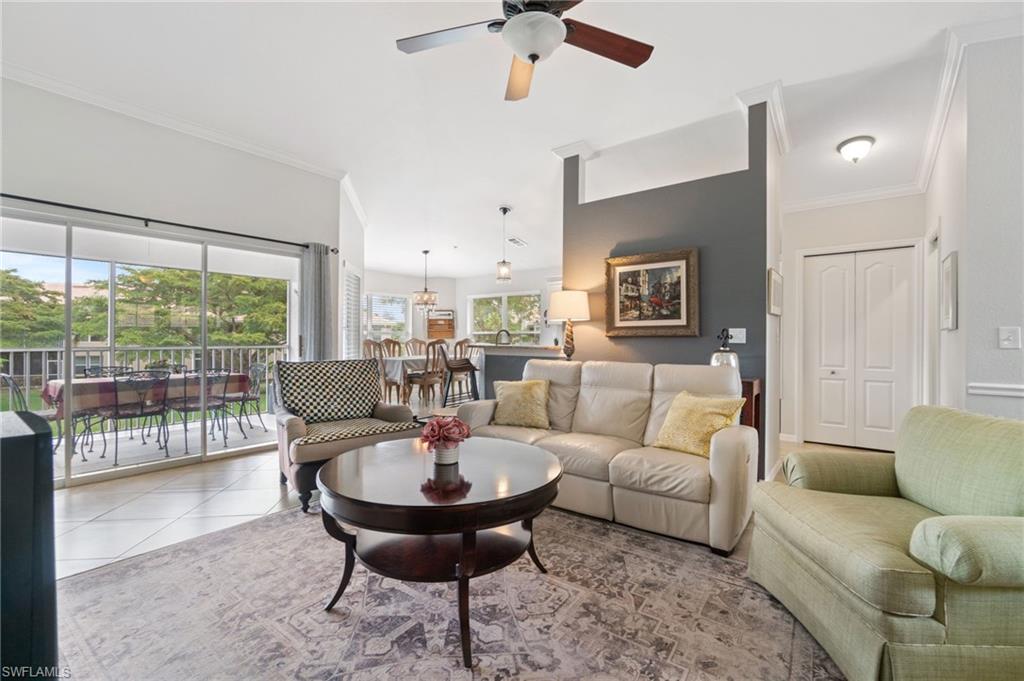 359 Dover Place, Unit E204 Naples, FL 34104 - Photo 10 of 49 a living room with furniture and a table