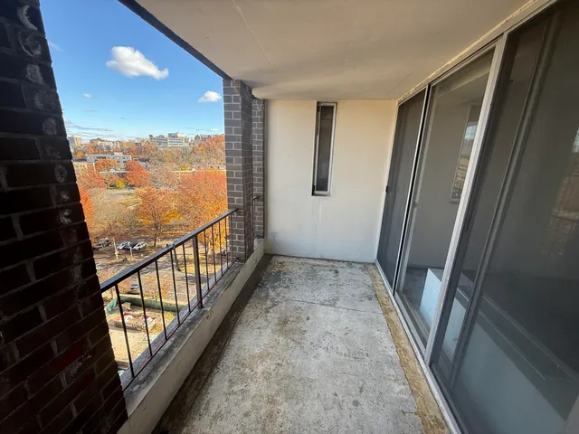 a view of balcony with wooden floor