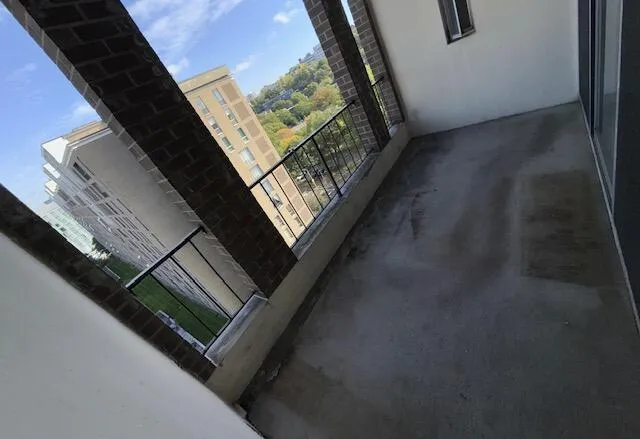 a view of empty room with floor to ceiling window