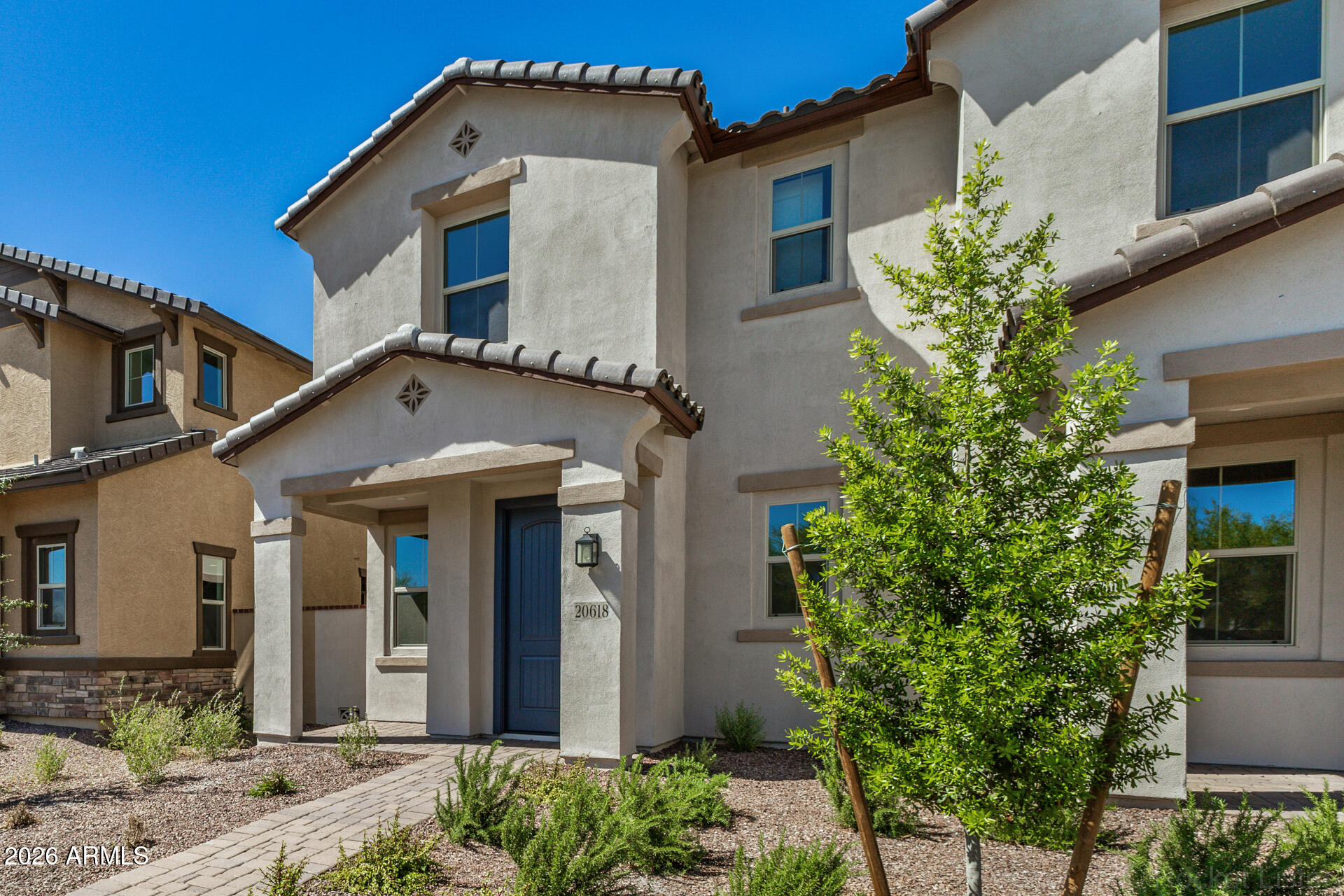 20618 West Thomas Road Buckeye, AZ 85396 - Photo 36 of 38 a front view of a house with plants