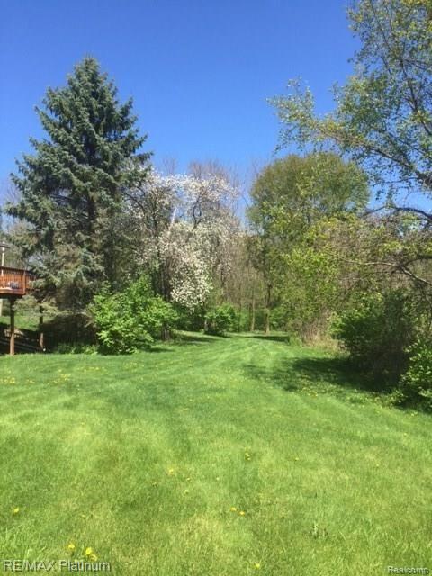 2755 North Hughes Road Howell, MI 48855 - Photo 13 of 57 Property between the house and Pond facing North