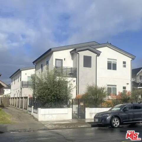a view of a car parked in front of a house