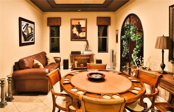 a living room with fireplace furniture and a flat screen tv