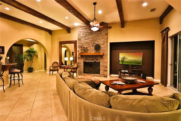 a bedroom with a bed and large glass door