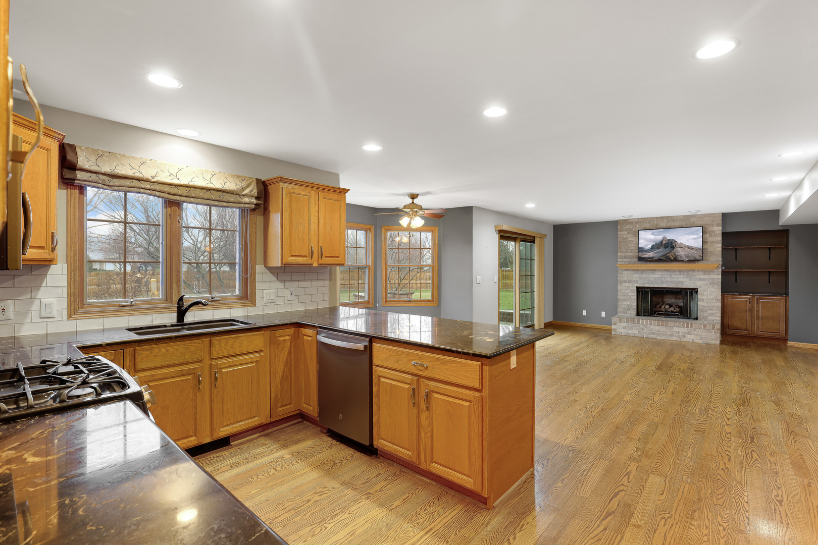 959 Willow Circle DeKalb, IL 60115 - Photo 15 of 39 a large kitchen with stainless steel appliances granite countertop a sink and cabinets