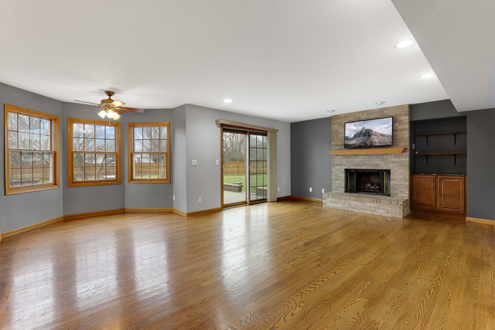 959 Willow Circle DeKalb, IL 60115 - Photo 17 of 39 a view of an empty room with wooden floor and a window