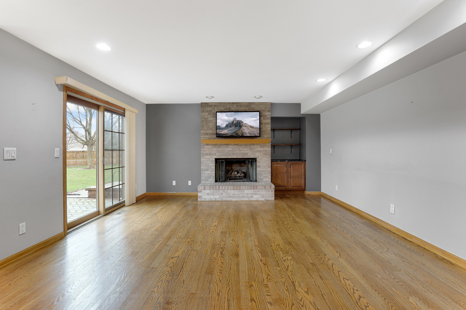 959 Willow Circle DeKalb, IL 60115 - Photo 18 of 39 a view of an empty room with a window and fireplace