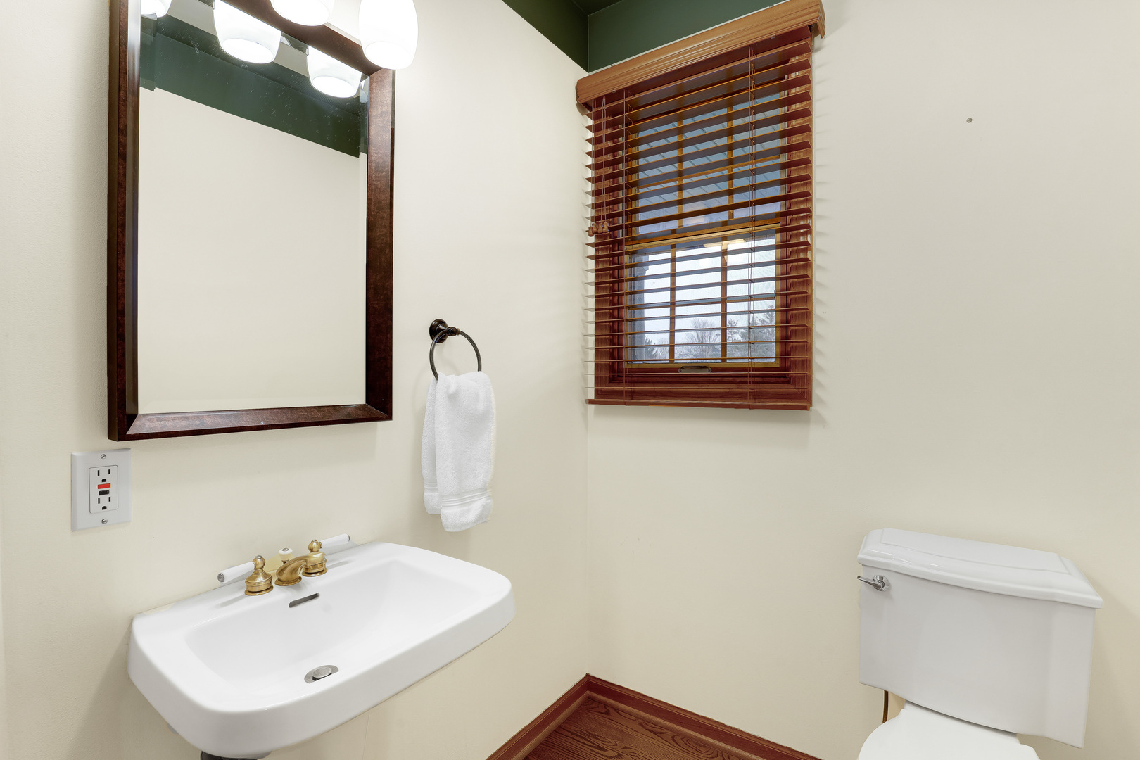 959 Willow Circle DeKalb, IL 60115 - Photo 24 of 39 a bathroom with a sink a mirror and a toilet