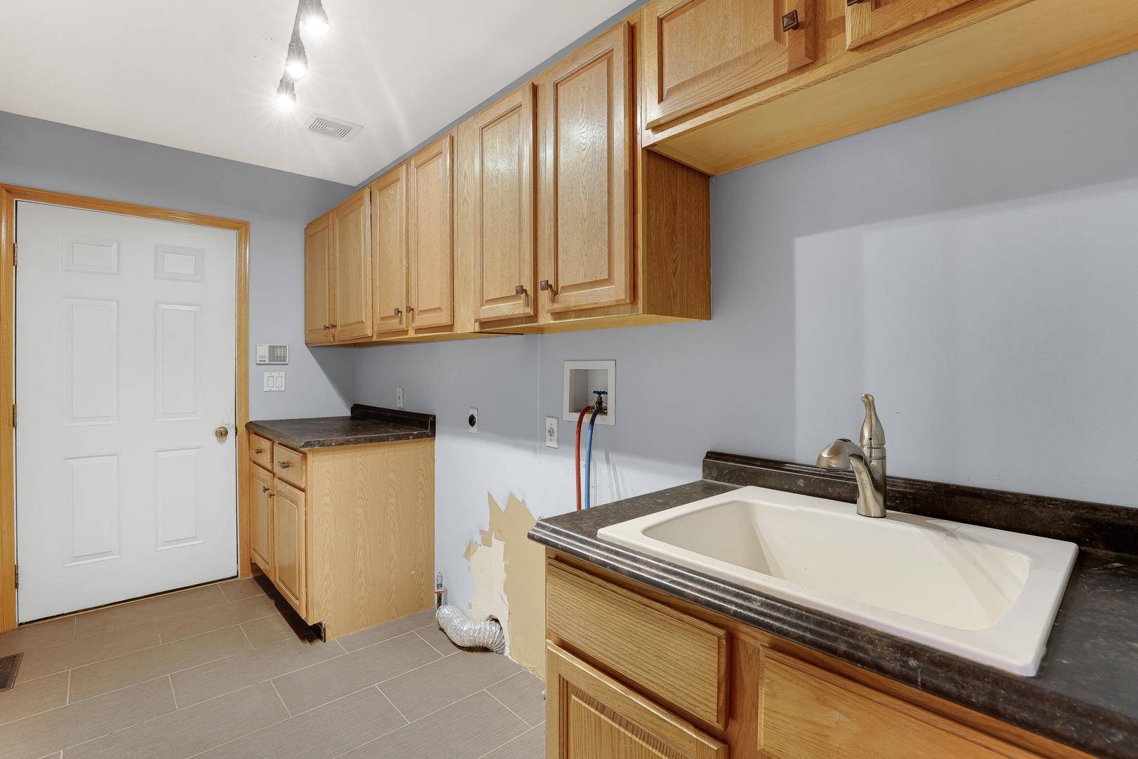 959 Willow Circle DeKalb, IL 60115 - Photo 25 of 39 a kitchen with a sink cabinets and appliances