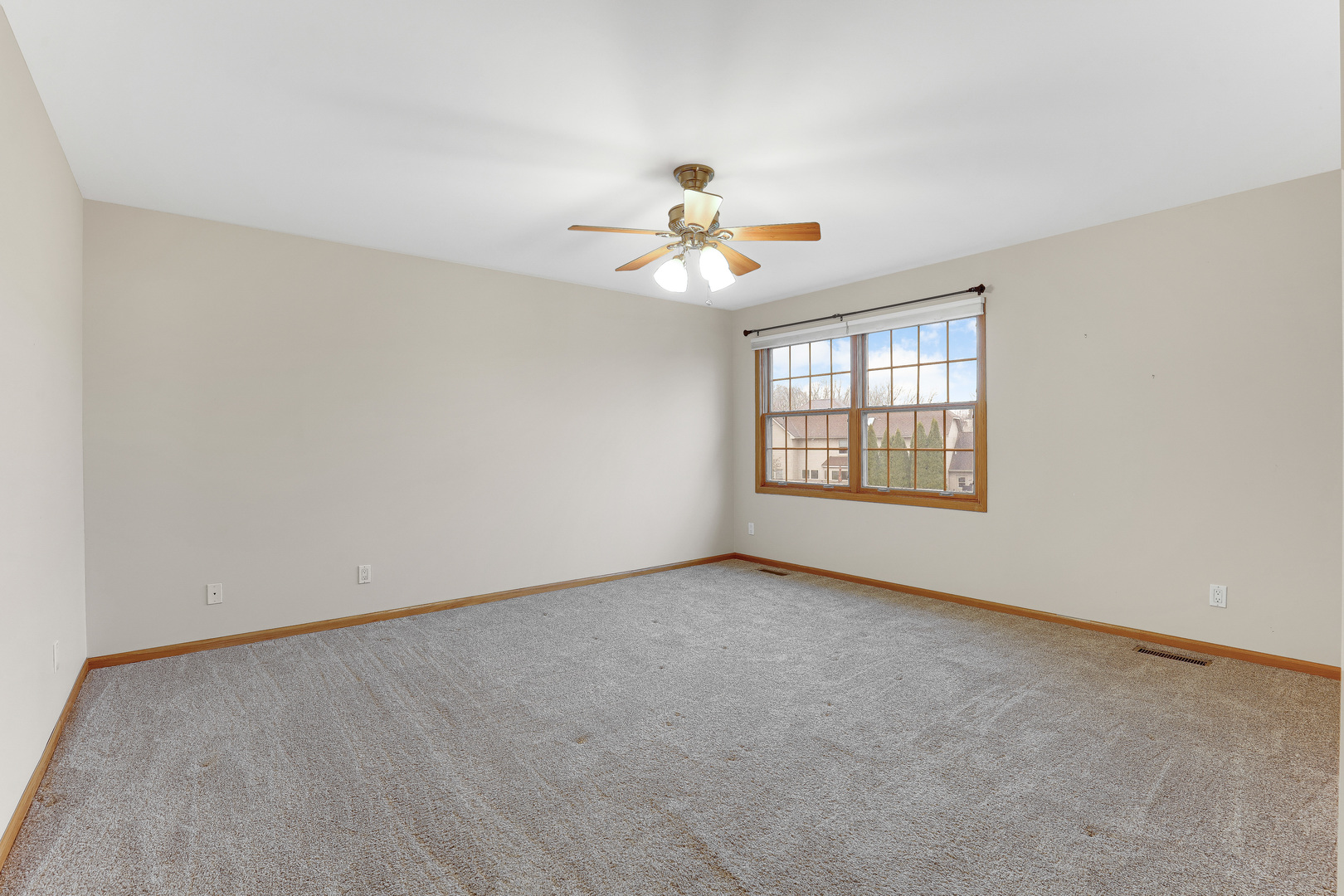 959 Willow Circle DeKalb, IL 60115 - Photo 27 of 39 an empty room with windows and ceiling fan view