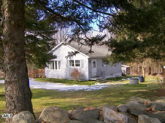 20 West Whisconier Road Brookfield, CT 06804 - Photo 1 of 1 a view of a house with pool and sitting area