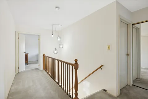 a view of a hallway view with staircase