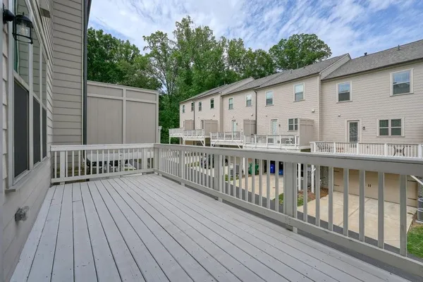 a view of a wooden deck with a yard
