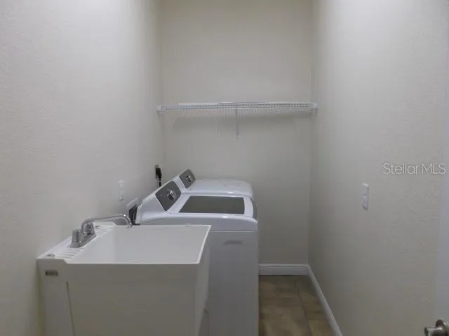 a bathroom with a sink and vanity