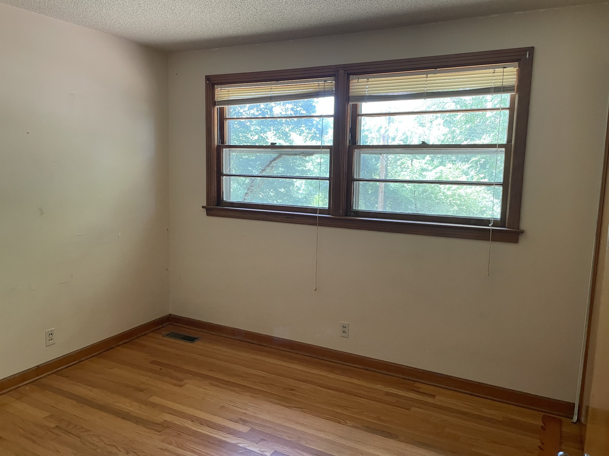 2004 Post Road Clarksville, TN 37043 - Photo 12 of 16 an empty room with wooden floor and windows