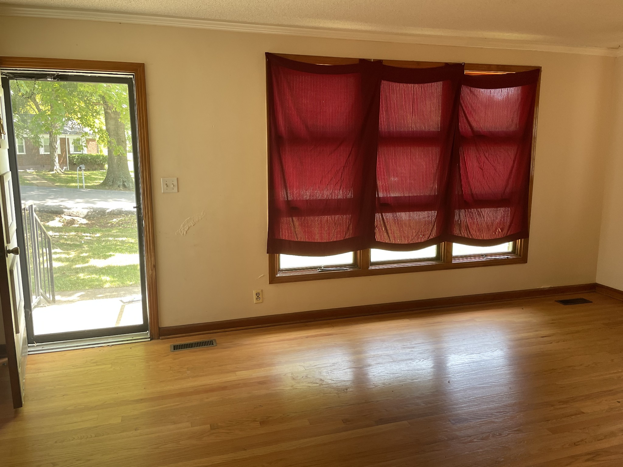 2004 Post Road Clarksville, TN 37043 - Photo 5 of 16 a view of an empty room with wooden floor and a window