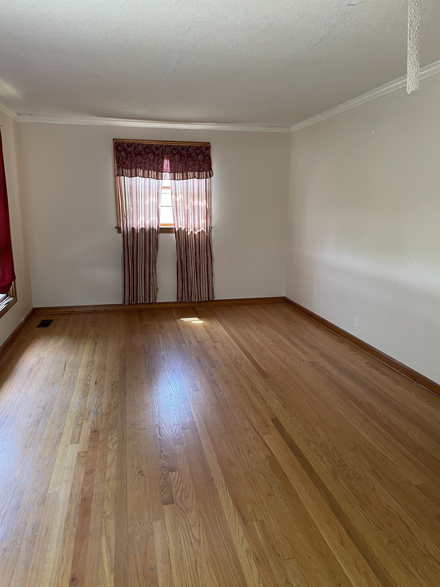 2004 Post Road Clarksville, TN 37043 - Photo 6 of 16 an empty room with wooden floor and windows
