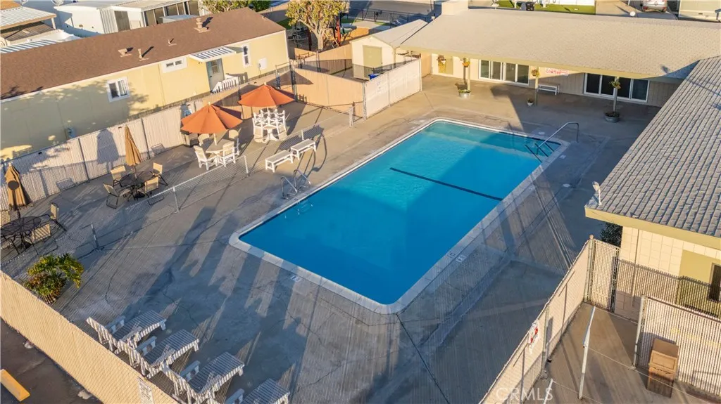 5580 Moreno Street, Unit 87 Montclair, CA 91763 - Photo 15 of 19 a view of a balcony with wooden floor and fence