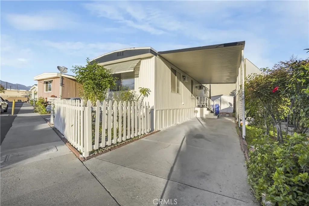 5580 Moreno Street, Unit 87 Montclair, CA 91763 - Photo 2 of 19 a view of a house with backyard and entertaining space