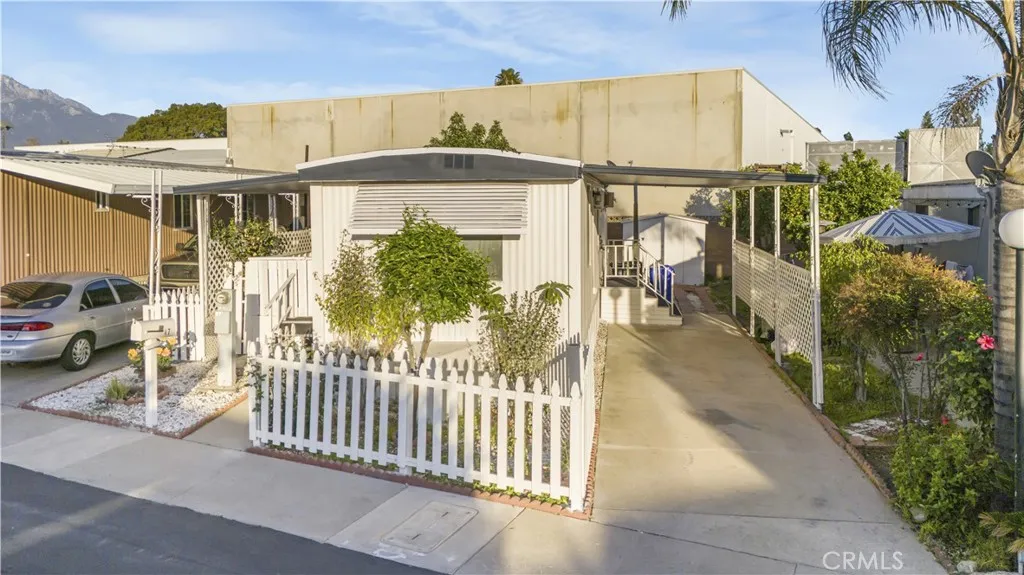 5580 Moreno Street, Unit 87 Montclair, CA 91763 - Photo 3 of 19 a view of a house with a porch