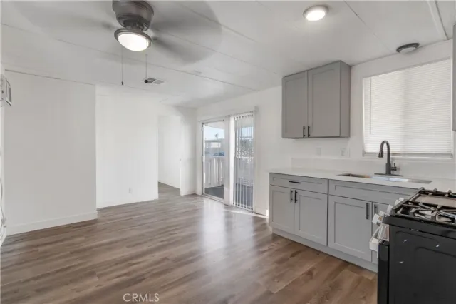 a kitchen with stainless steel appliances granite countertop a stove and a sink