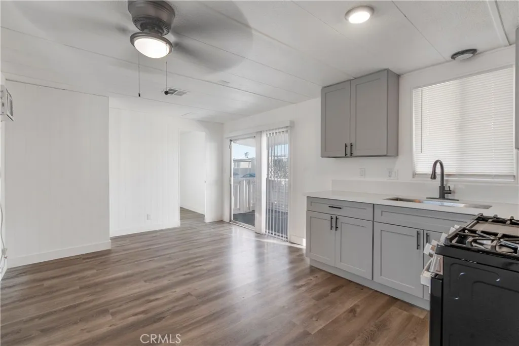 5580 Moreno Street, Unit 87 Montclair, CA 91763 - Photo 5 of 19 a kitchen with stainless steel appliances granite countertop a stove and a sink