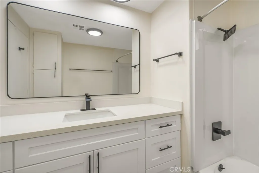 5580 Moreno Street, Unit 87 Montclair, CA 91763 - Photo 9 of 19 a bathroom with a sink and a mirror