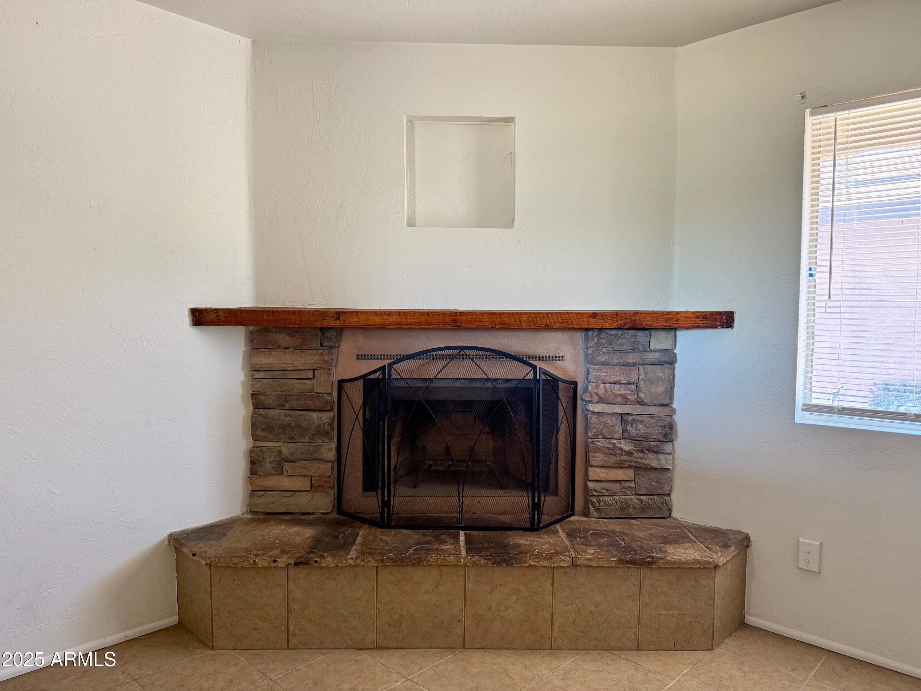 28 West Elm Street Tucson, AZ 85705 - Photo 14 of 14 a living room with furniture and a fireplace