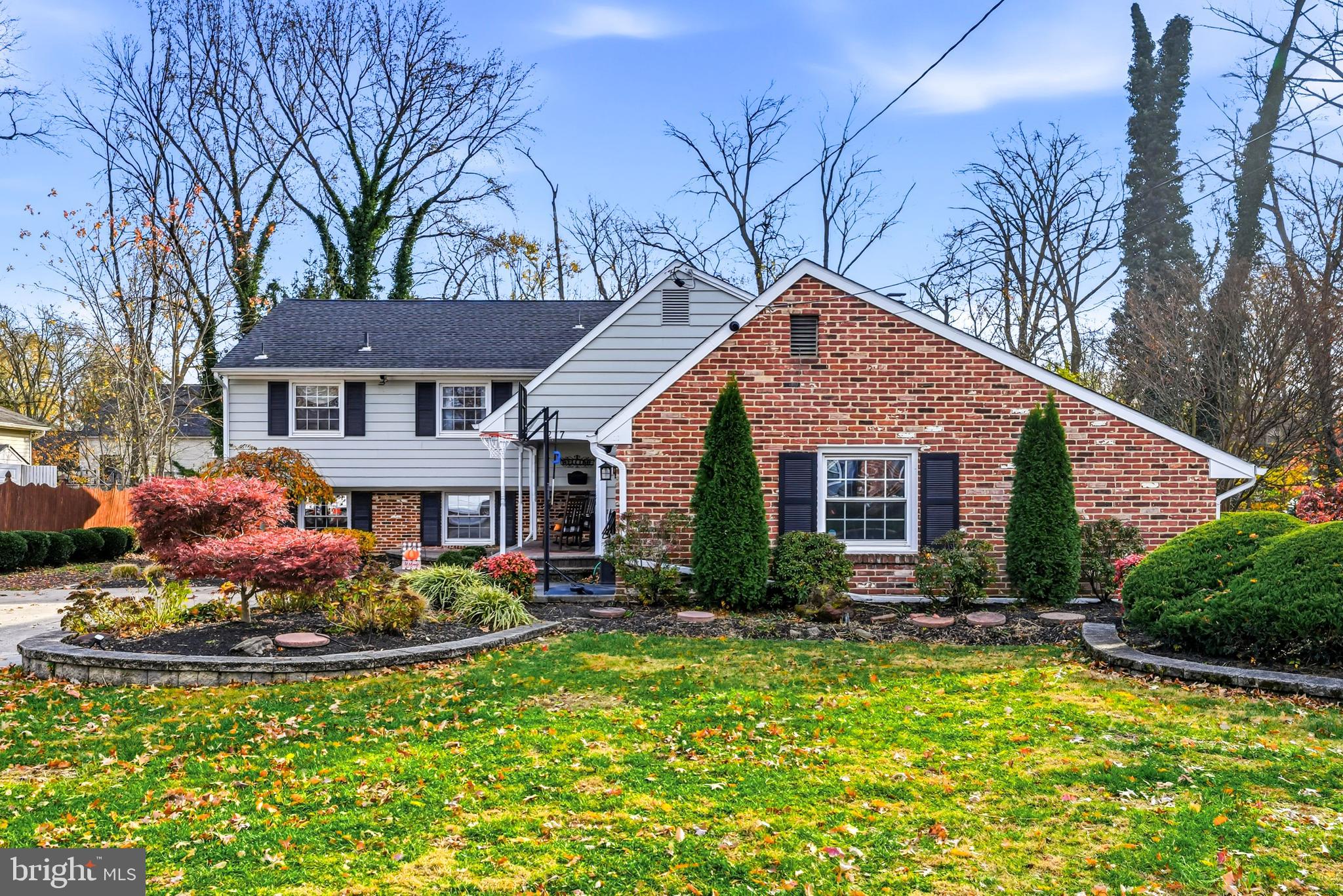 a front view of a house with a yard table and chairs