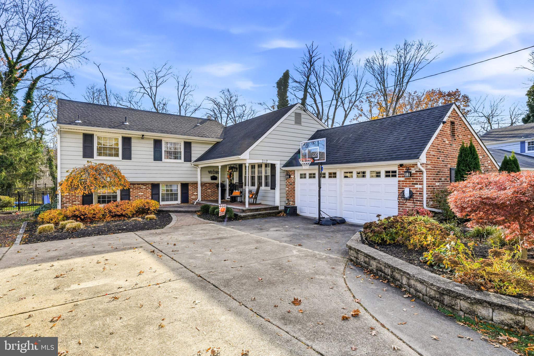 217 Red Stone Ridge Cherry Hill, NJ 08034 - Photo 2 of 44 a front view of a house with garden