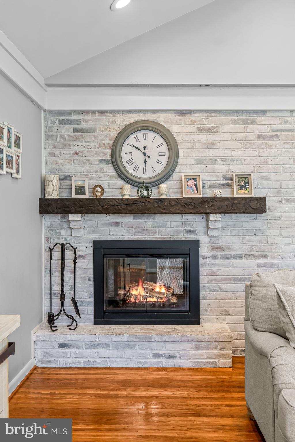 217 Red Stone Ridge Cherry Hill, NJ 08034 - Photo 24 of 44 a living room with a fireplace and a clock