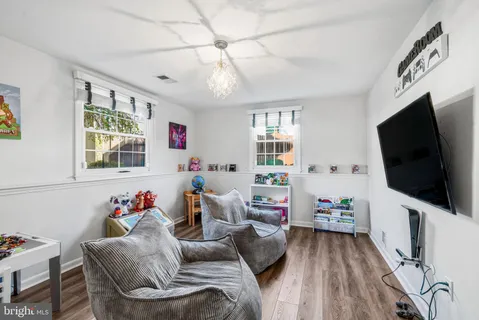 a bathroom with a sink mirror and toilet
