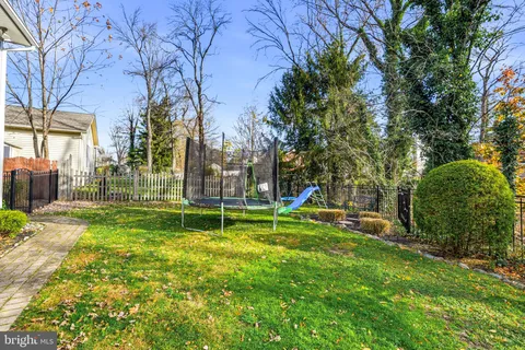 a view of a house with a yard porch and sitting area