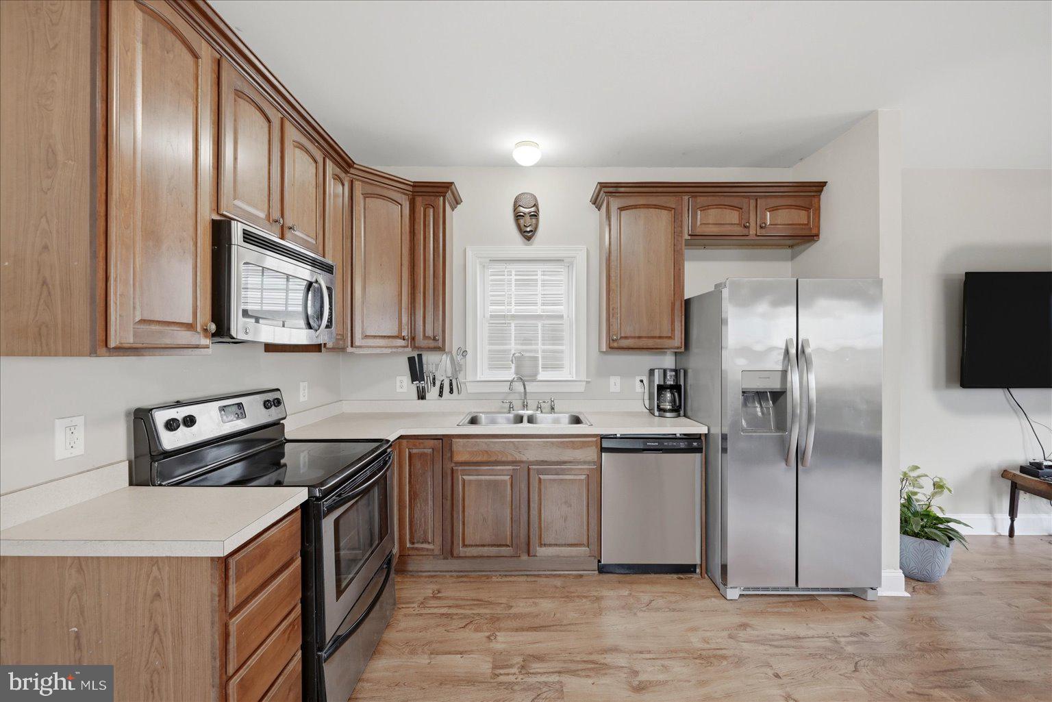 16 South Pleasant Valley Road Winchester, VA 22601 - Photo 6 of 34 Modern kitchen with warm wood tones