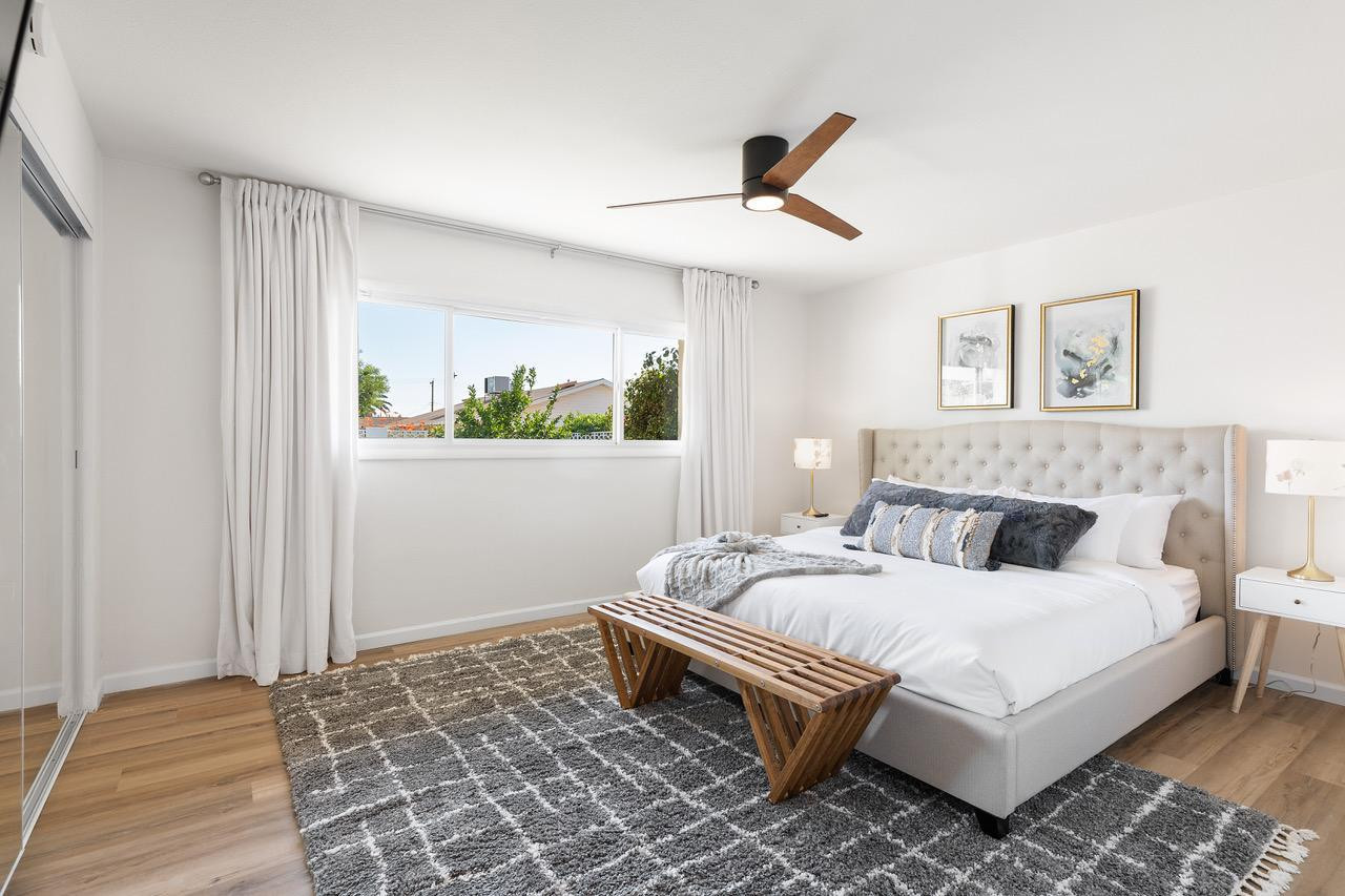 8307 East Arlington Road Scottsdale, AZ 85250 - Photo 13 of 25 a bedroom with a bed and a window