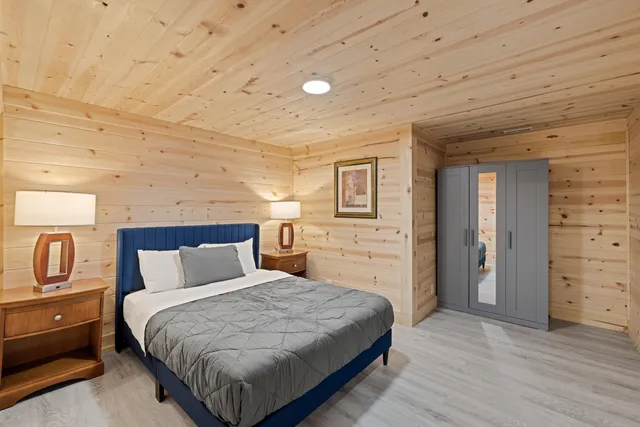 a bedroom with a bed and a view of bathroom