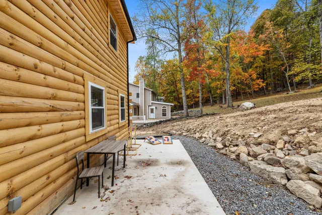 a view of a backyard with chairs