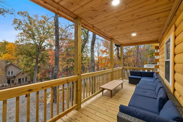 a view of a chairs and table in the balcony